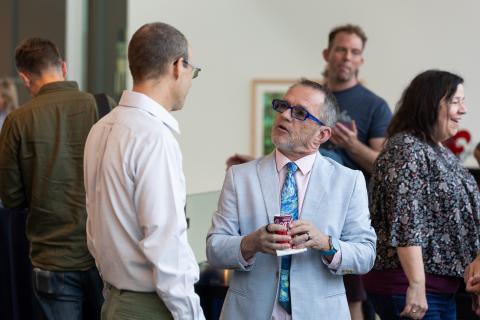 Dr. Maloy and Dr. Auter speak informally at the State of the College