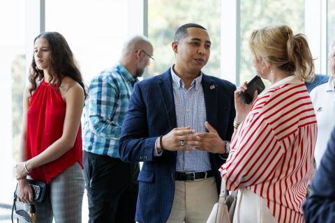 Advisory Board members talk informally at the State of the College