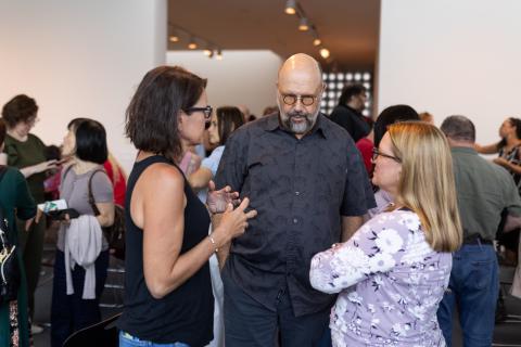 Dr. Leroy talks informally with others at the State of the College